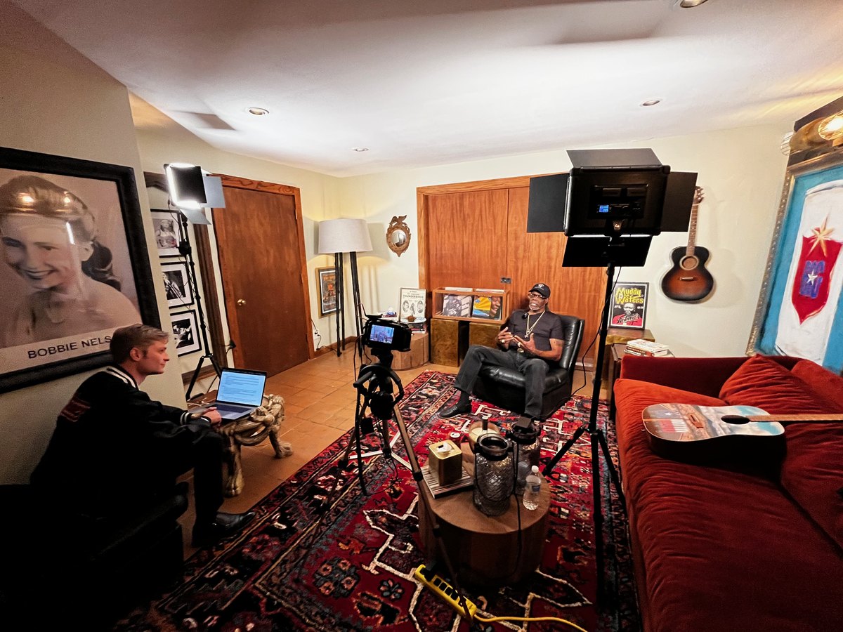 An oral history recording session set up in a client's living room