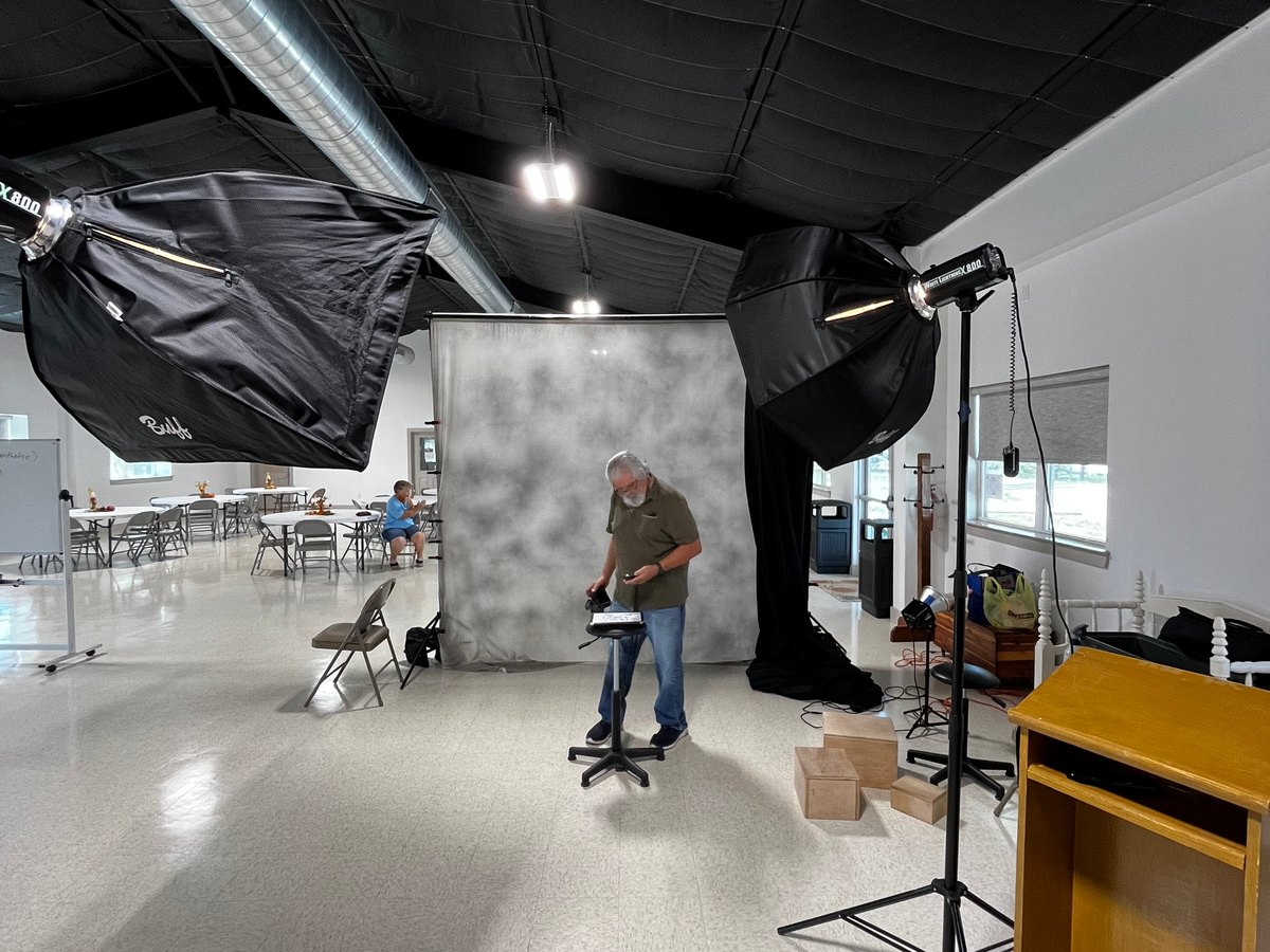 A portable portrait studio set up inside a community activity room